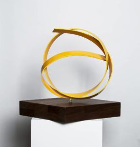 Joe Gitterman, "Yellow Knot on Walnut Base," stainless steel, painted